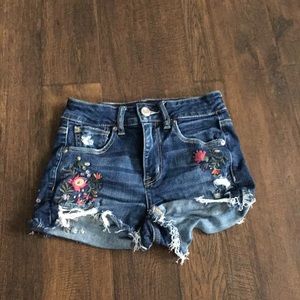 Dark blue shorts with flower pattern